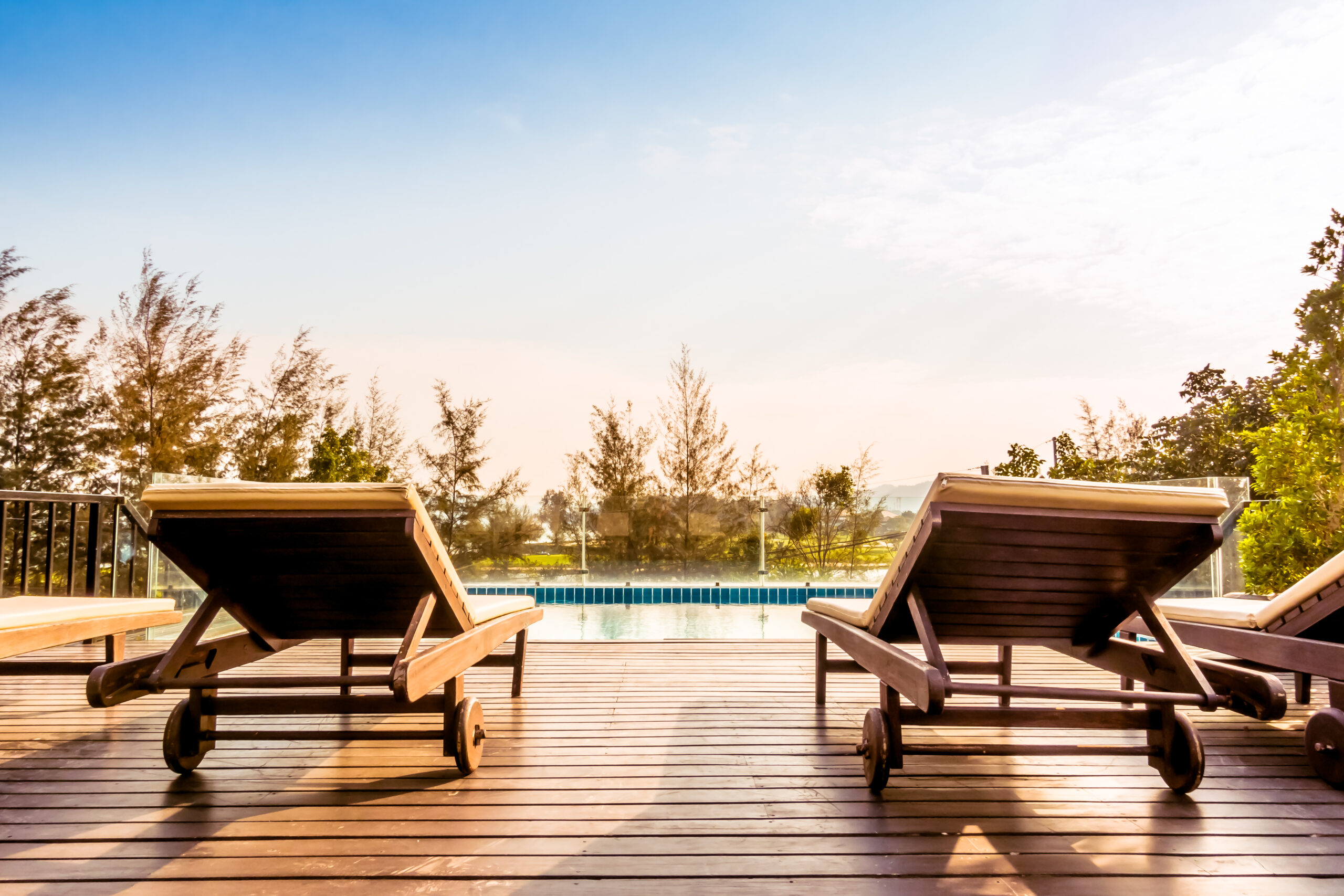 Swimming pool Empty chair and swimming pool at hotel resort - Vintage Filter